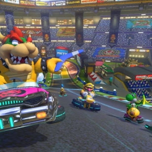 Mario Kart 8 kurvailee trailereilla ja sateenkaaritien kuvilla