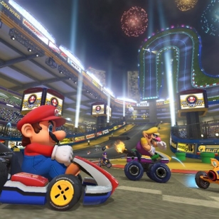 Mario Kart 8 kurvailee trailereilla ja sateenkaaritien kuvilla