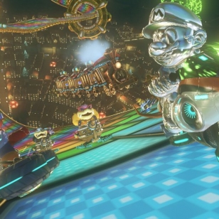 Mario Kart 8 kurvailee trailereilla ja sateenkaaritien kuvilla