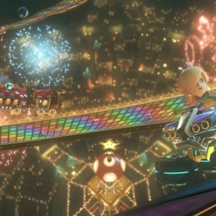 Mario Kart 8 kurvailee trailereilla ja sateenkaaritien kuvilla